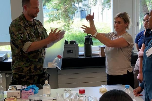 Instructor Ms Narelle Moss of the Southern Police of Australia explains sample handling to training participants.