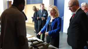 Minister of Education, Culture and Science of the Netherlands, Dr Jet Bussemaker (middle) and OPCW Director-General Ahmet Üzümcü examine chemical weapon inspection equipment.
