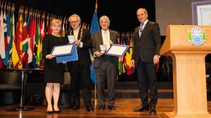 The inaugural OPCW-The Hague Award was awarded to Verifin, accepted by the Director Paula Vanninen, left, with Mr. Jozias van Aartsen, the mayor of The Hague; and Dr. Robert (Bob) Mathews, second from right with Director-General Ahmet Üzümcü at the 19th Conference of States Parties on 1 December 2014.
