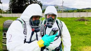 Training participants consult detection equipment during the simulated chemical emergency.